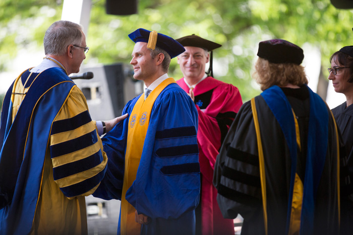 Gus Danowski accepts an honorary degree on behalf of his father, Raymond Danowski, whose collections became one of Emory's literary jewels, the Raymond Danowski Poetry Library.