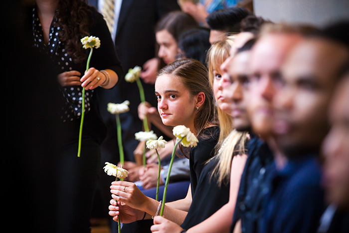 Attendees holding flowers.