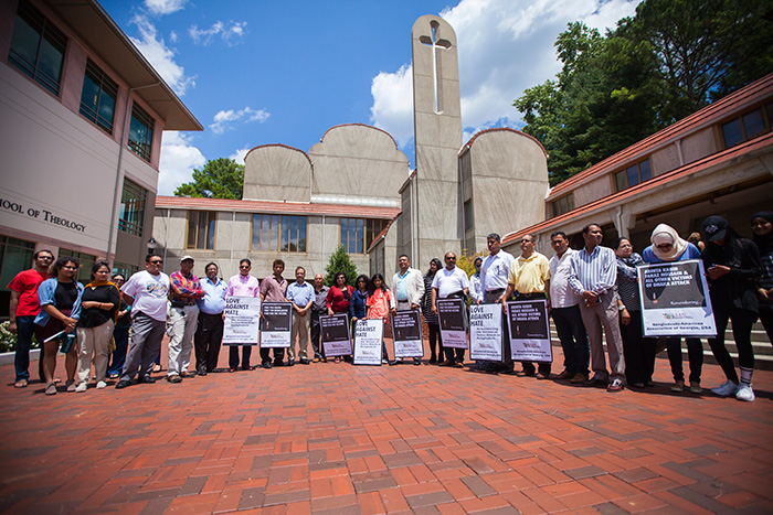 Members of the Bangladeshi-American Association of Georgia gathered outside of Cannon Chapel with signs offering prayers and calling for "love against hate."