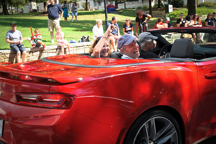 Emory President Claire E. Sterk and her husband, research professor Kirk Elifson, in the Homecoming Parade. 