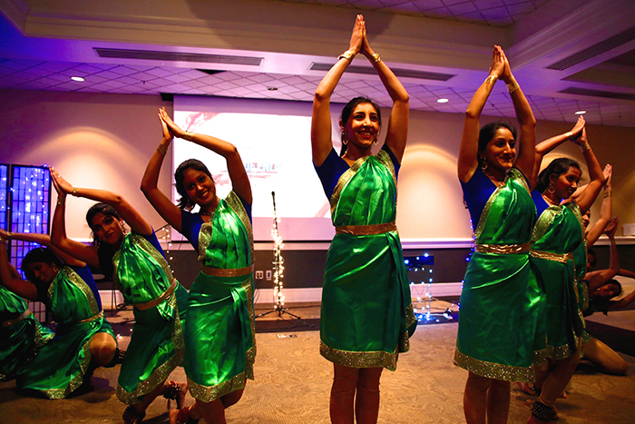 female students in indian dress dancing