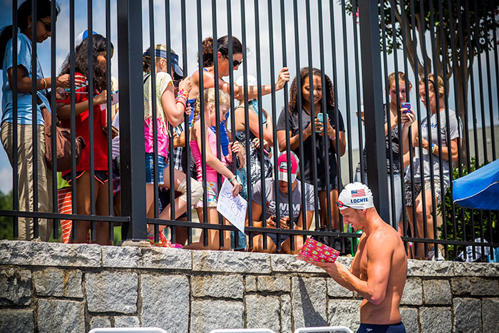 swimmer signing autographs
