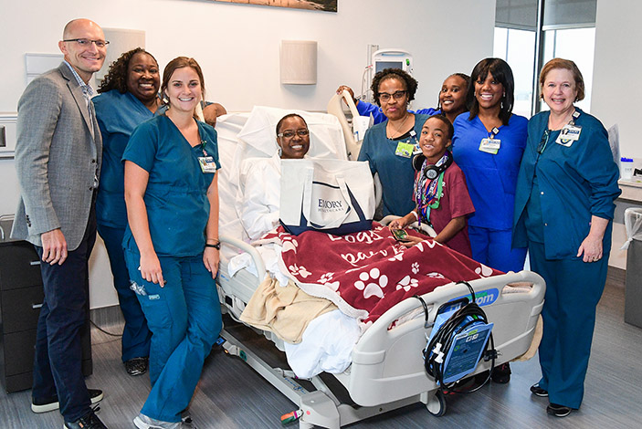 It¿s all smiles and cheers as McCollum arrives in her inpatient room in the new Emory University Hospital Tower.