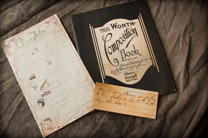 Flannery O'Connor's school composition book with her Savannah address on the cover, and an illustrated story from her childhood entitled "My People." 