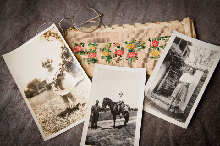 Family photographs of O'Connor, a pair of eyeglasses and a piece of needlepoint that says "Hope."