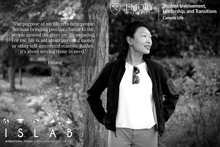 Black and white image of a woman standing in front of a tree with her hands on her hips. She is looking off to the right. She wears a white shirt with khaki pants and a light jacket. There is a quote embedded in the image.