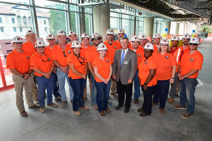 David Pugh, vice president for Facility and Space Design for Emory Healthcare stands with crew members from McCarthy Construction at the 'topping out' ceremony for the J-wing.