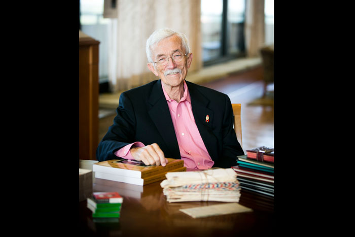 Longtime Atlanta AIDS activist Jesse Peel sits with his journals, letters and other items from his collection, which he placed with MARBL in 2012. 