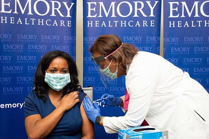 Emergency room nurse Nicole Baker was the first person at Emory Healthcare to receive a COVID-19 vaccination.