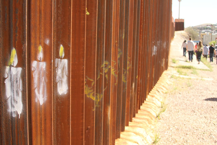 Graffiti on the U.S.-Mexico border wall serves as a makeshift memorial to those who died in the crossing.  
