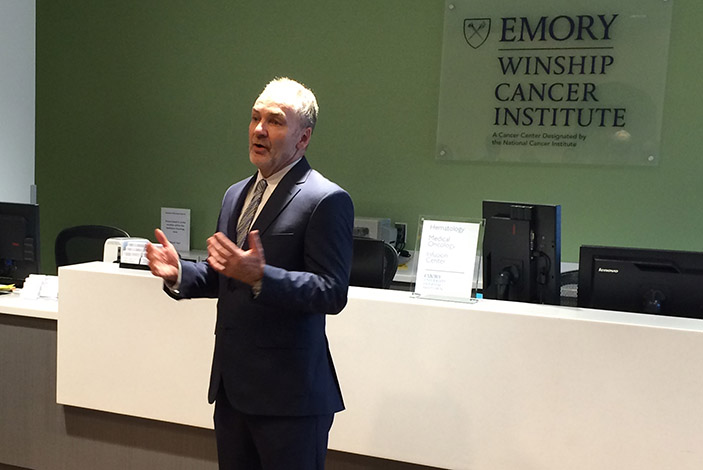 Winship Cancer Institute Executive Director Walter Curran, MD, addresses guests at the Open House.