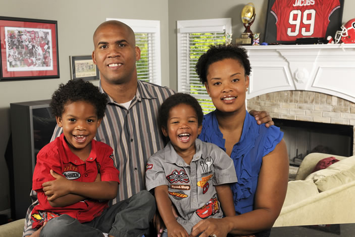  A stroke took David Jacobs off the football field, but he recovered to have a new career and start a family (shown here with his wife, Desiree, and their two sons).