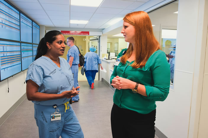 Like other clinicians at Emory University Hospital, surgeon Jahnavi Srinivasan (left) often receives referrals for patients with extremely complex conditions. The hospital provided almost $17 million in charity care last year.