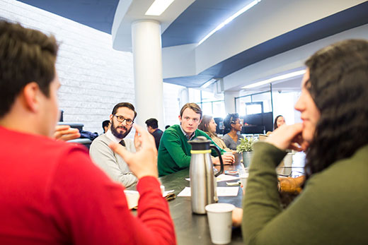 students and professors at coffee hour