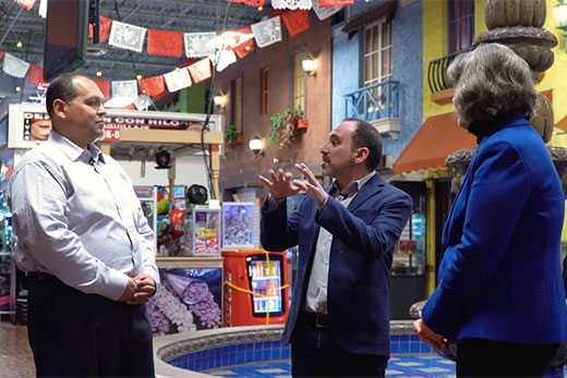 Julio Penaranda (left), general manager of Atlanta's Plaza Fiesta shopping center, speaks with Emory professors Pablo Palomino (center) and Vialla Hartfield-Mendez in a video interview included in the "Making Progress" Teach-Out.