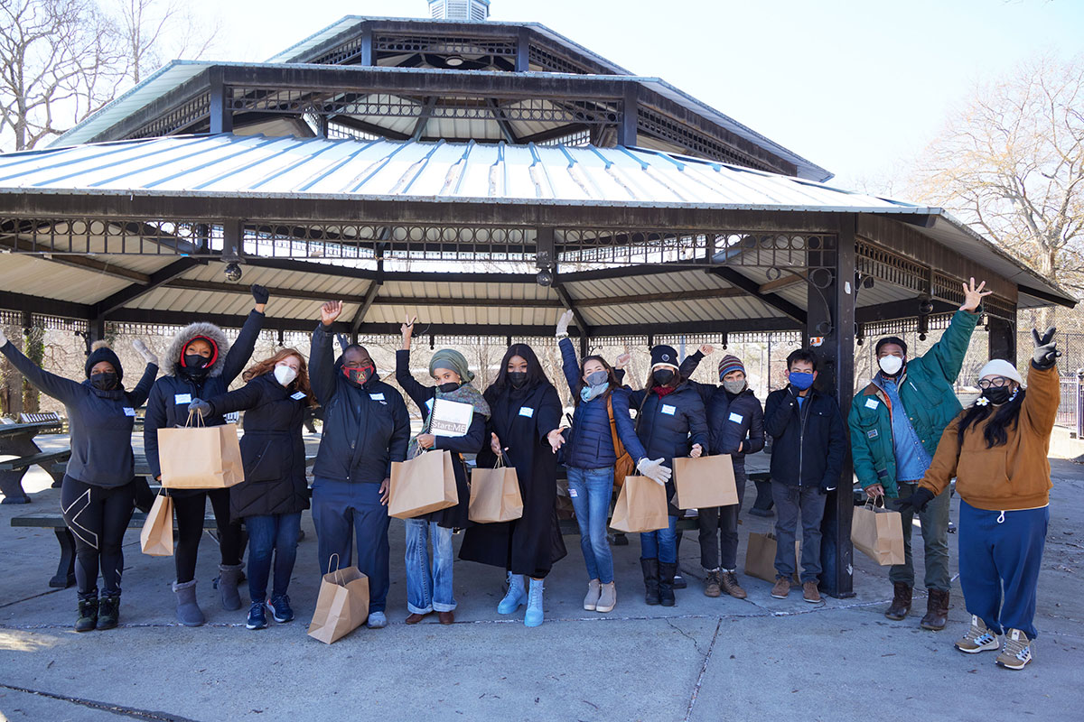 Students gather under a pavilion