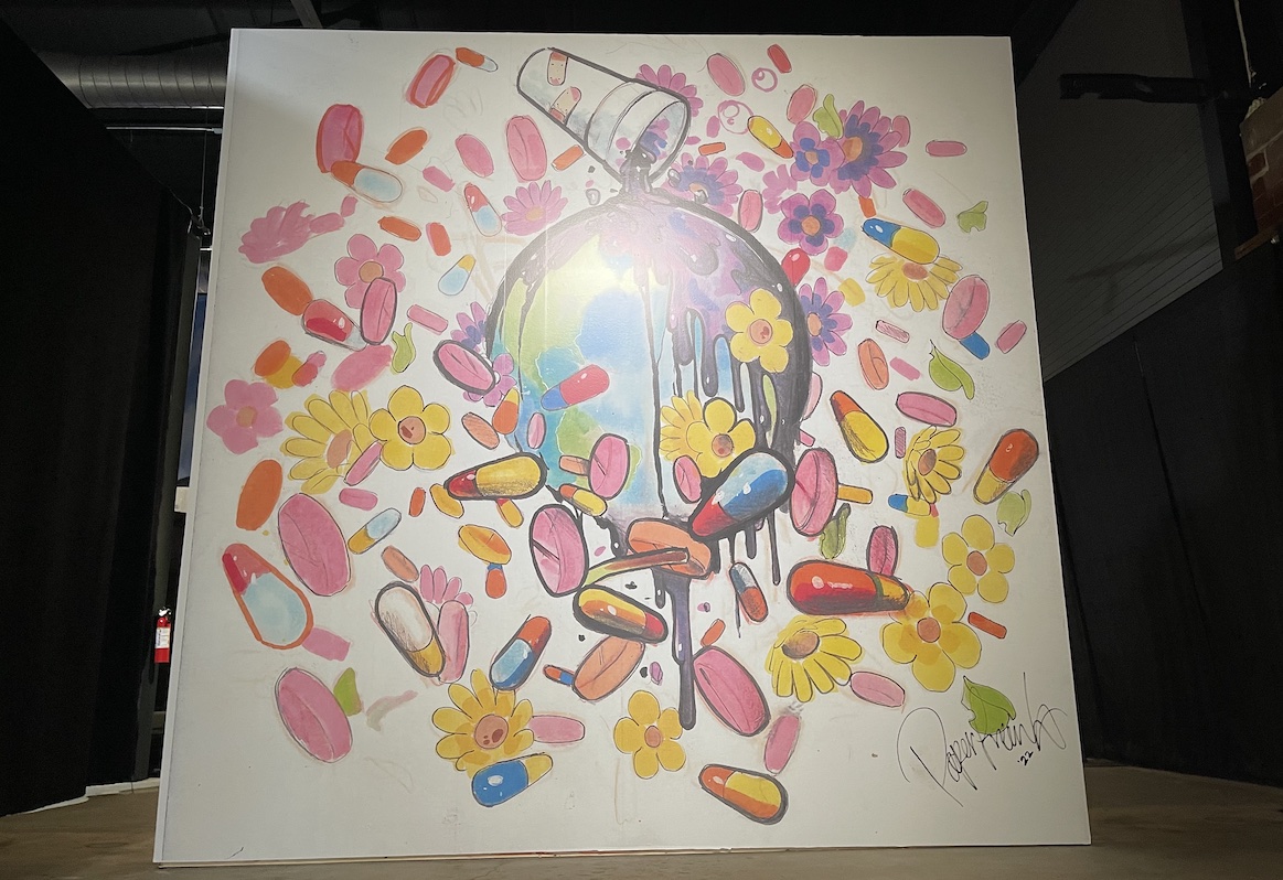 Single art piece depicting globe with pink pills