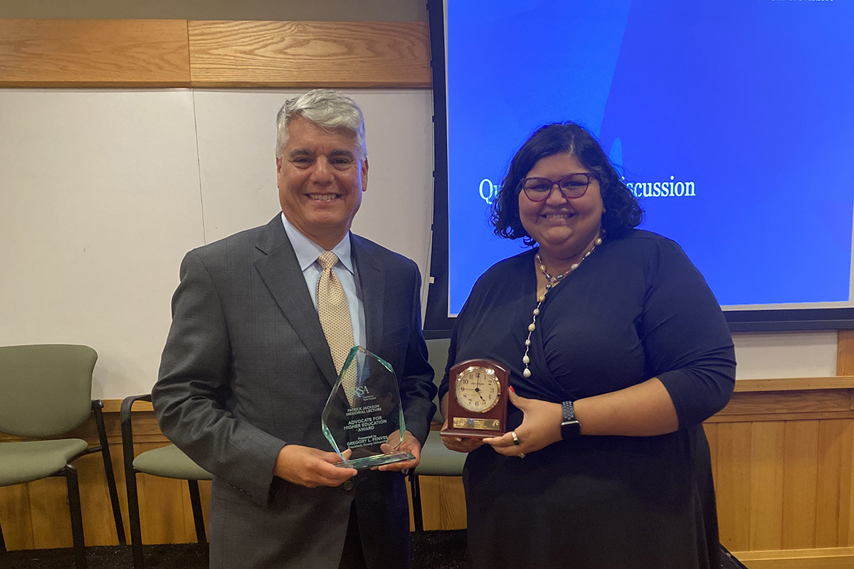 Emory President Gregory L. Fenves poses with Sheena McFarland