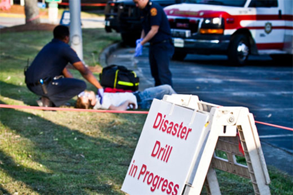 emergency workers beside a road