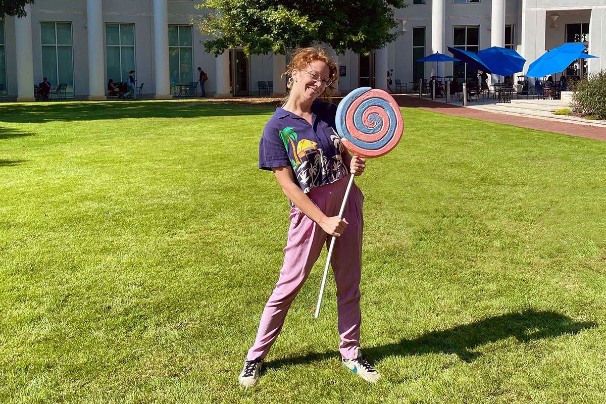 Person holding lollipop 