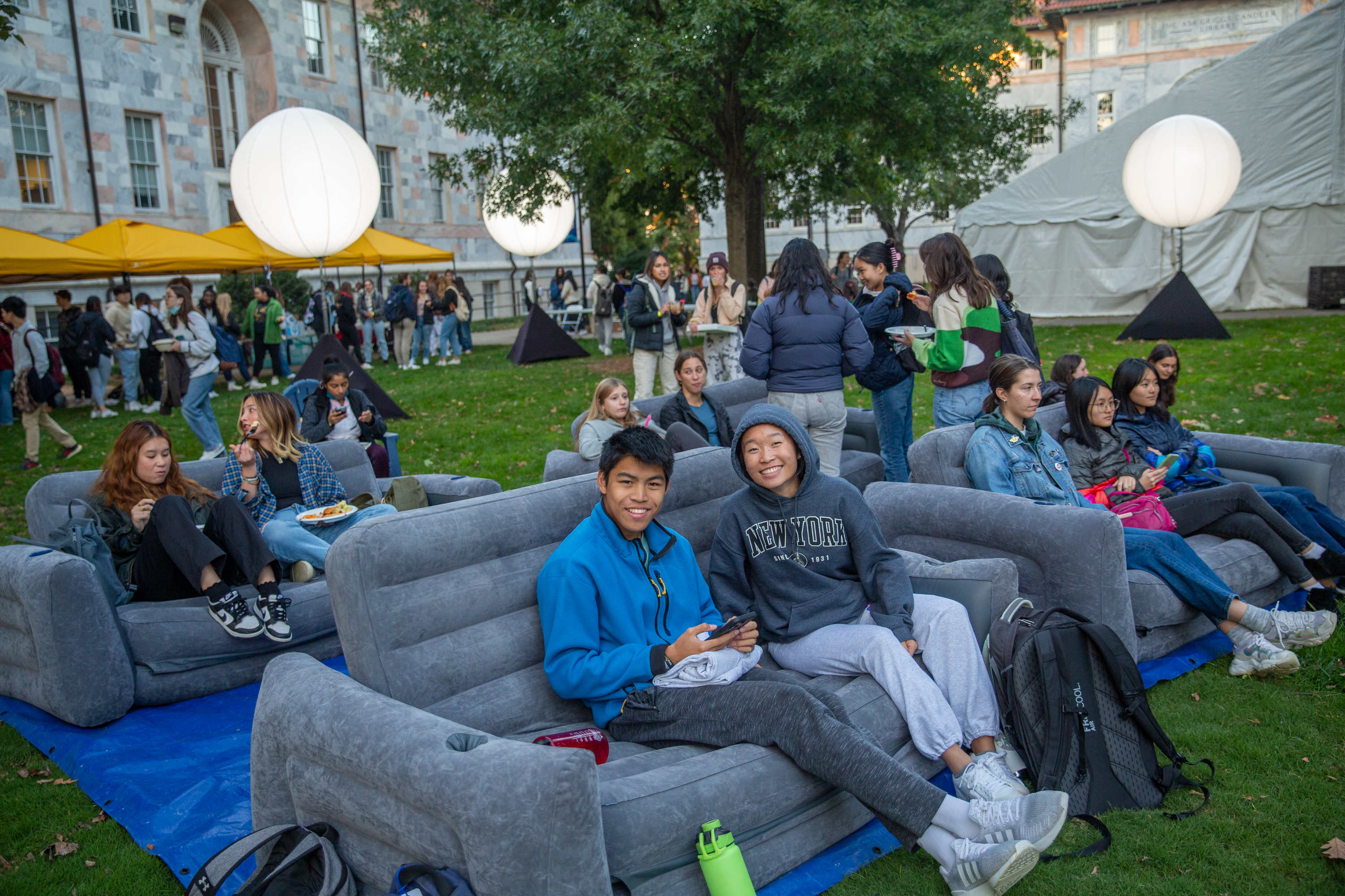 Students sitting outside on couch
