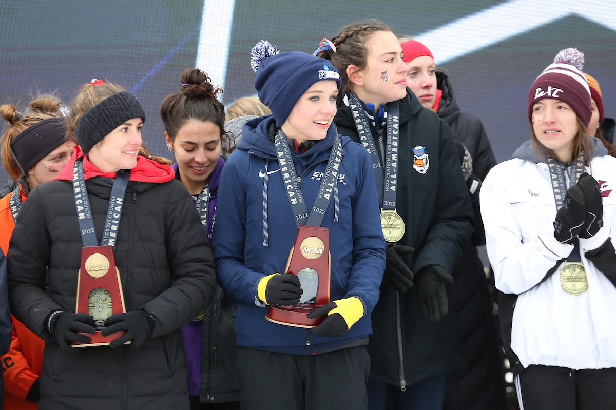 Photo: Group of student-athletes in winter clothing with medals and trophies