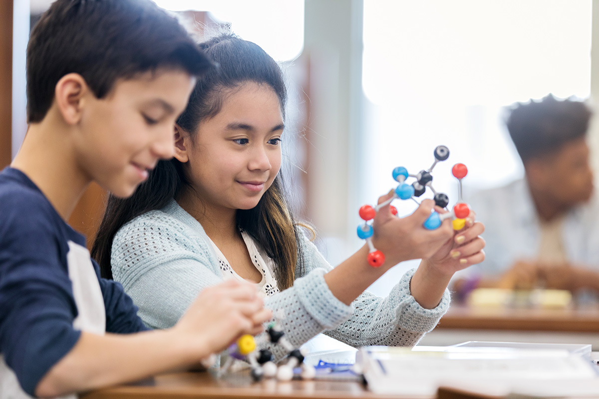 Middle school students in STEM classroom environment.