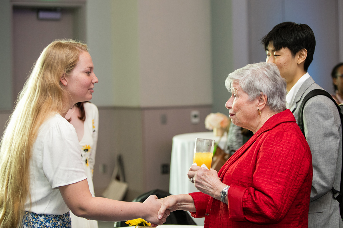 Student meeting an older alumni at the Ask an Alumni event