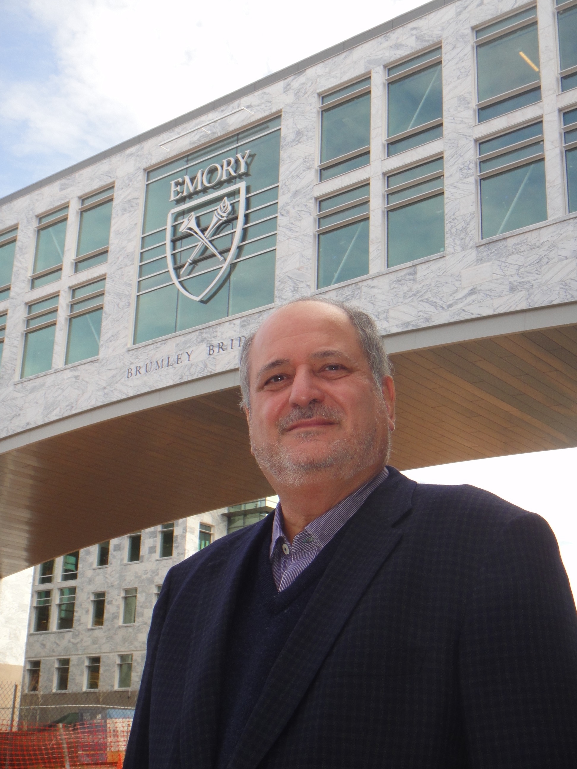 Raymond Schinazi in front of research building