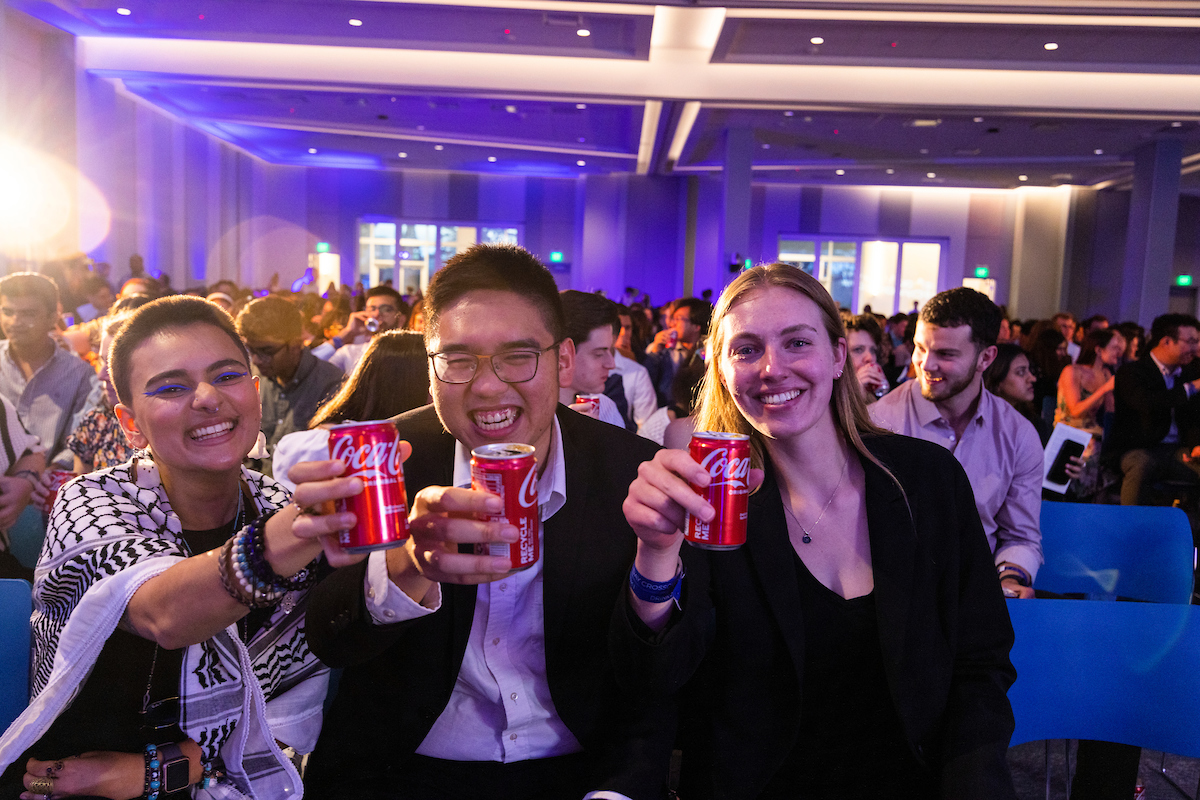 Students share a Coke Toast, led by President Gregory L. Fenves.