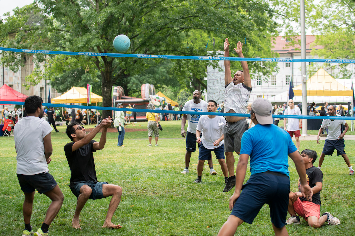 Photo of staff playing volleyball at Staff Fest