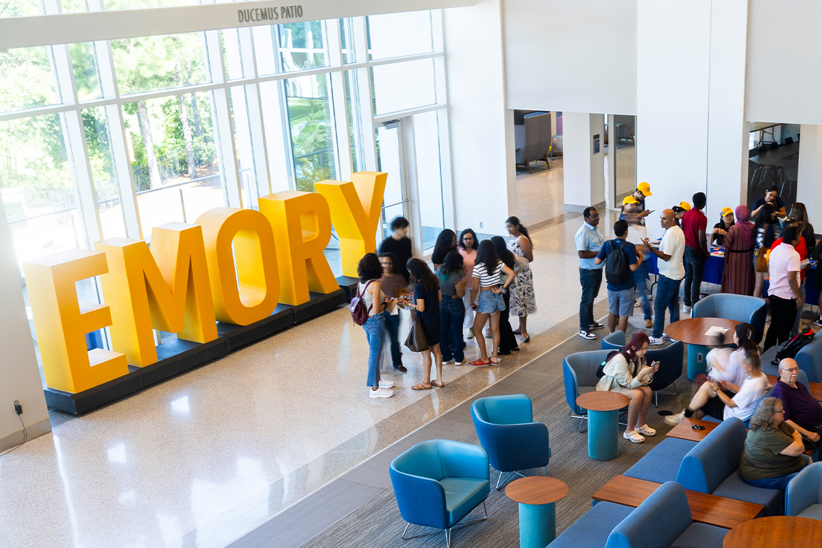 Photo: High-angle shot of students hanging out in ESC near giant Emory letters