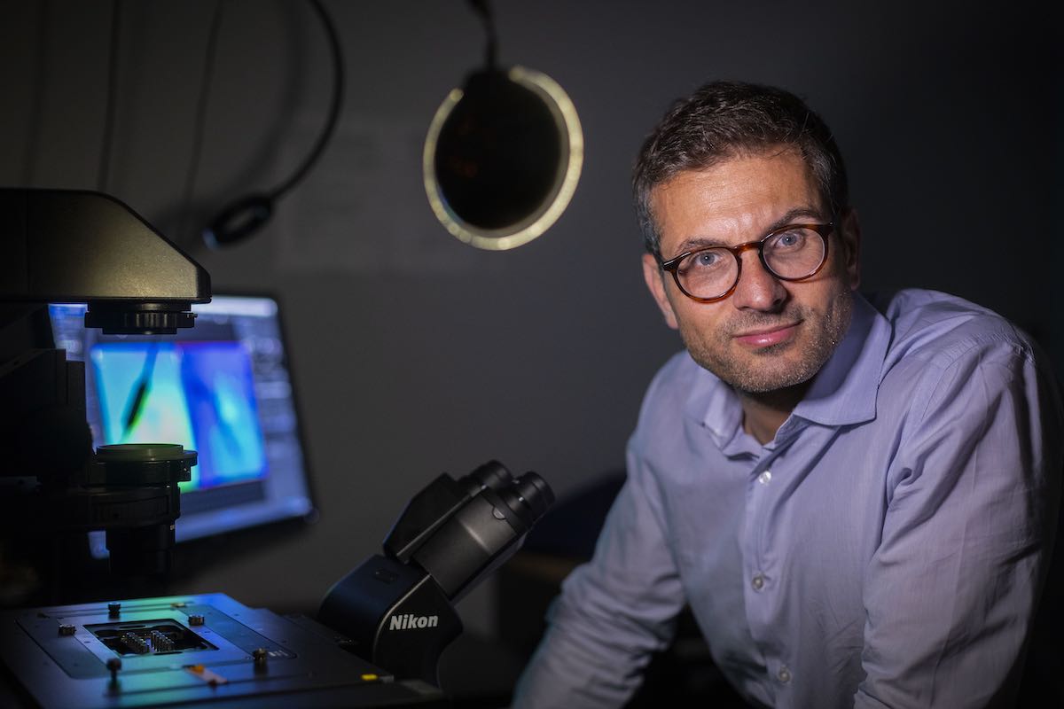 photo of Khalid Salaita sitting in his lab