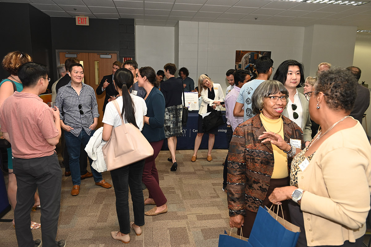 Attendees enjoy opening event