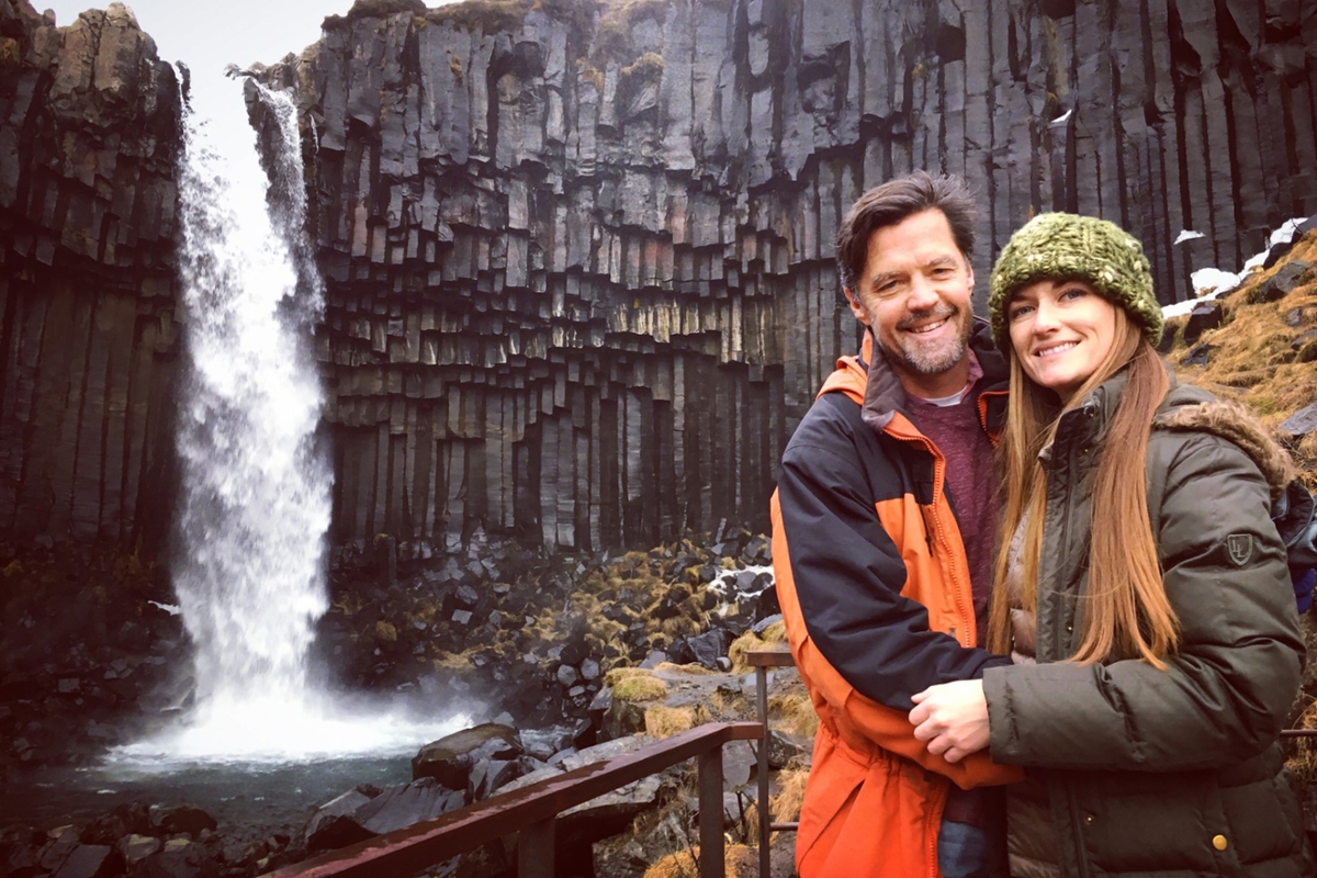 Aubrey and Rick in front of a waterfall