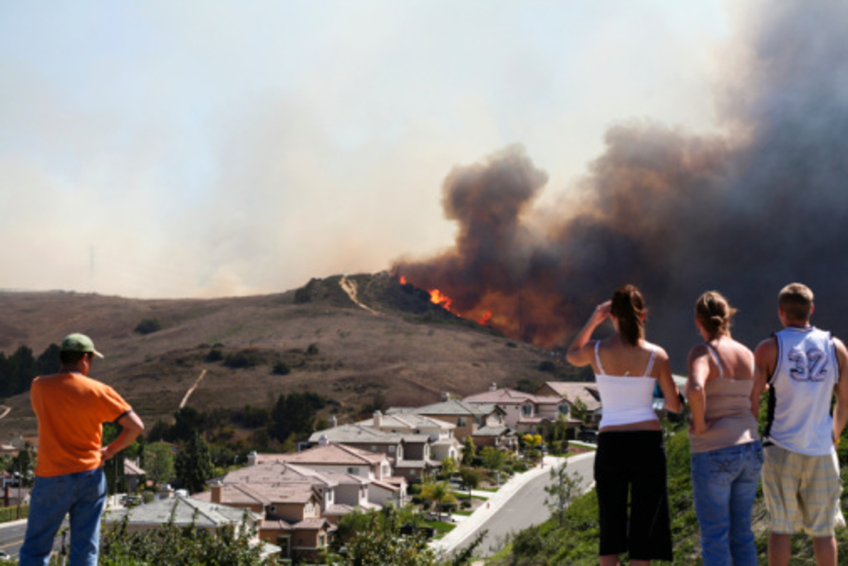 People watching wildfire burn near neighborhood