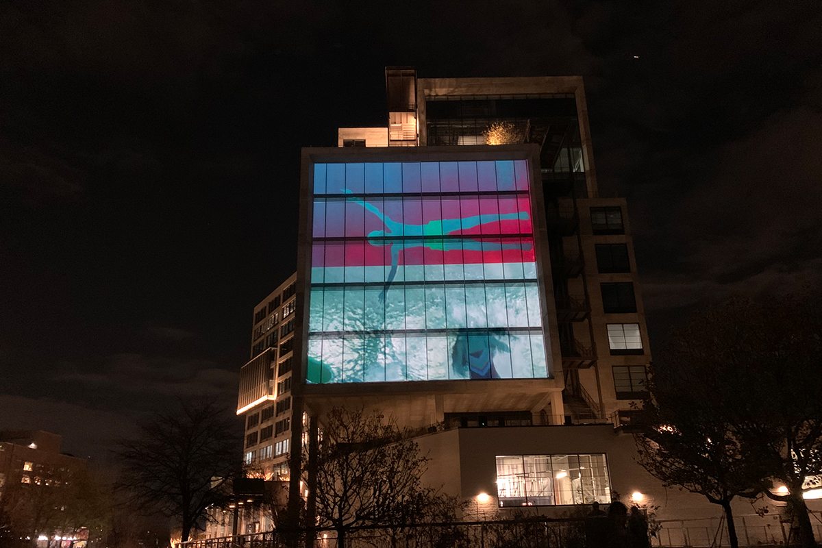 film projected on side of building on Atlanta's Beltline