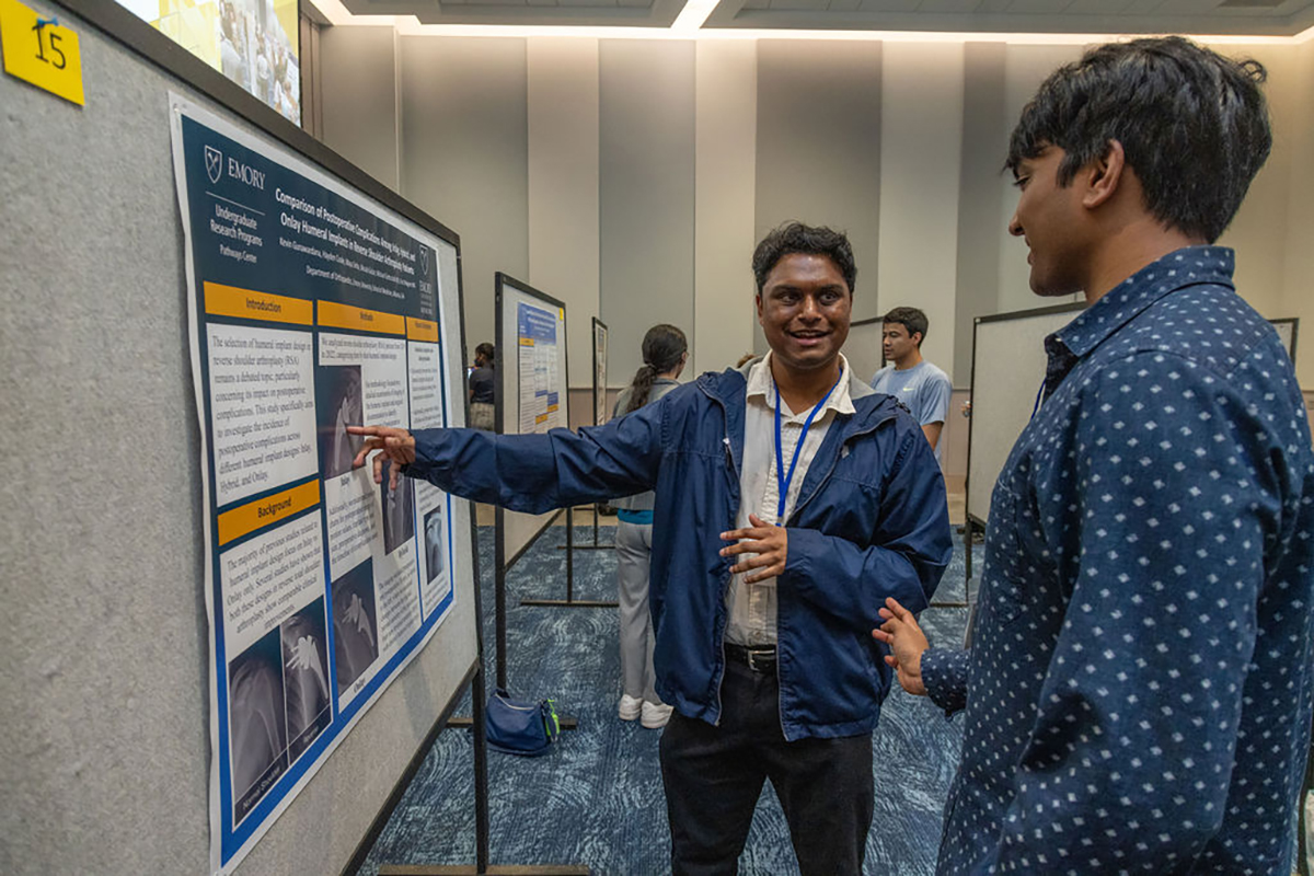 student presenting poster