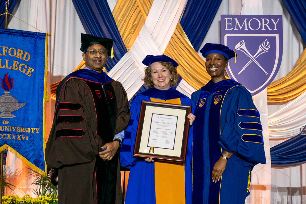 Emory professor Molly McGehee holding award plaque