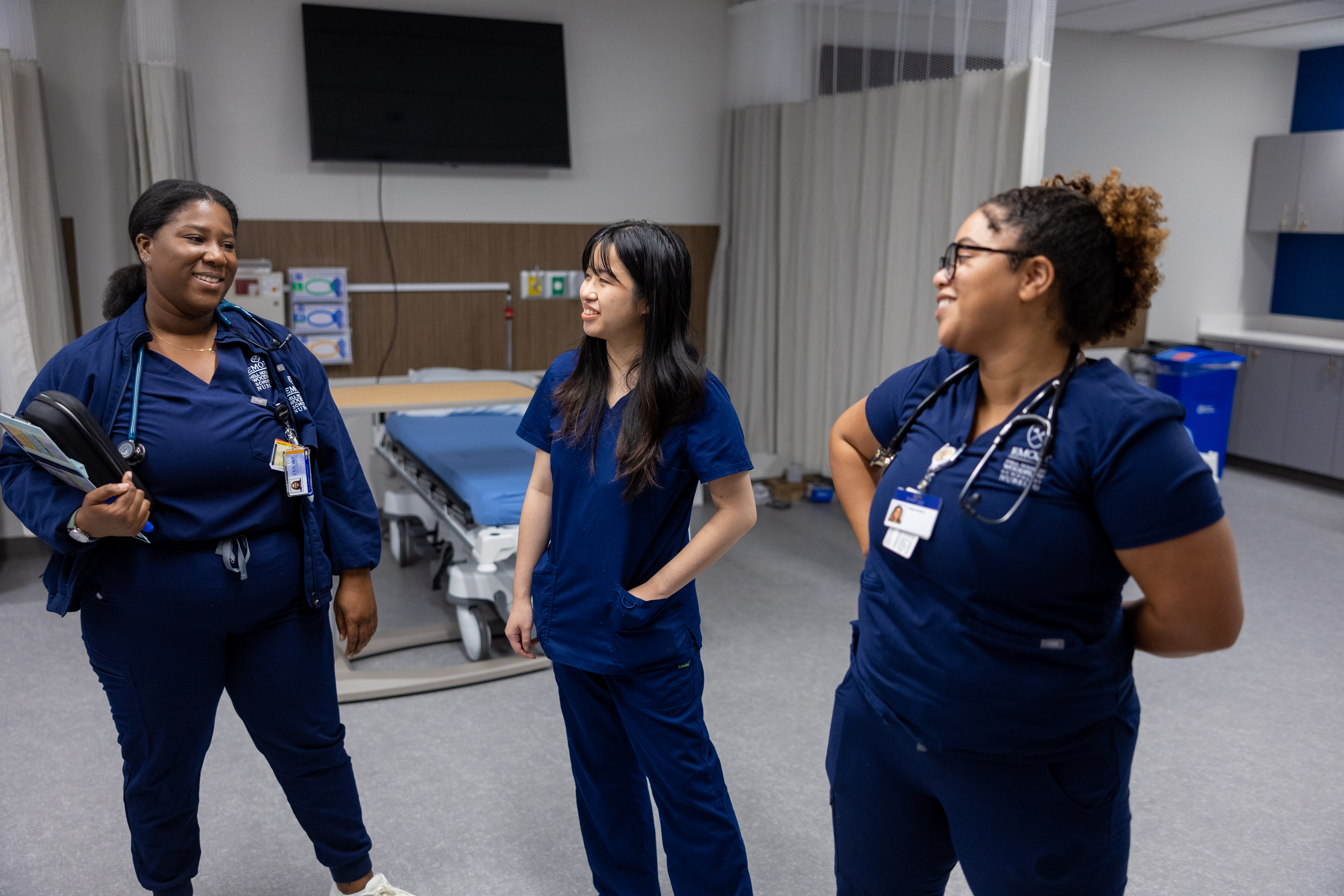 Photo of three nursing students in a simulation lab