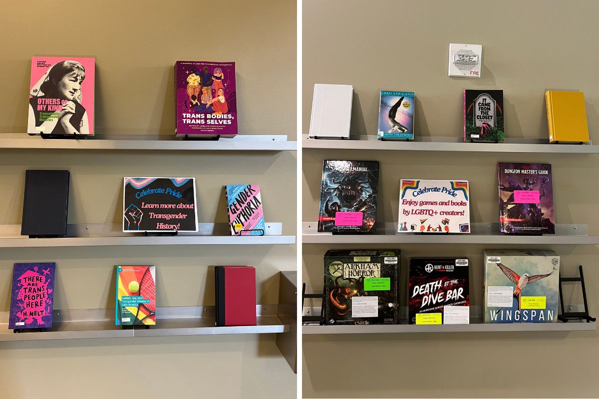Photo of book and board game display for Pride