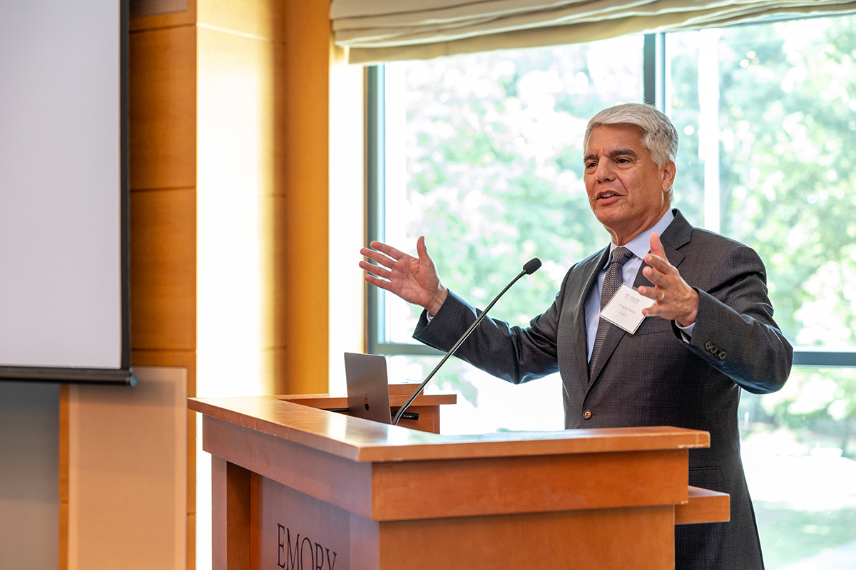 Gregory Fenves, president of Emory University, speaks from behind podium