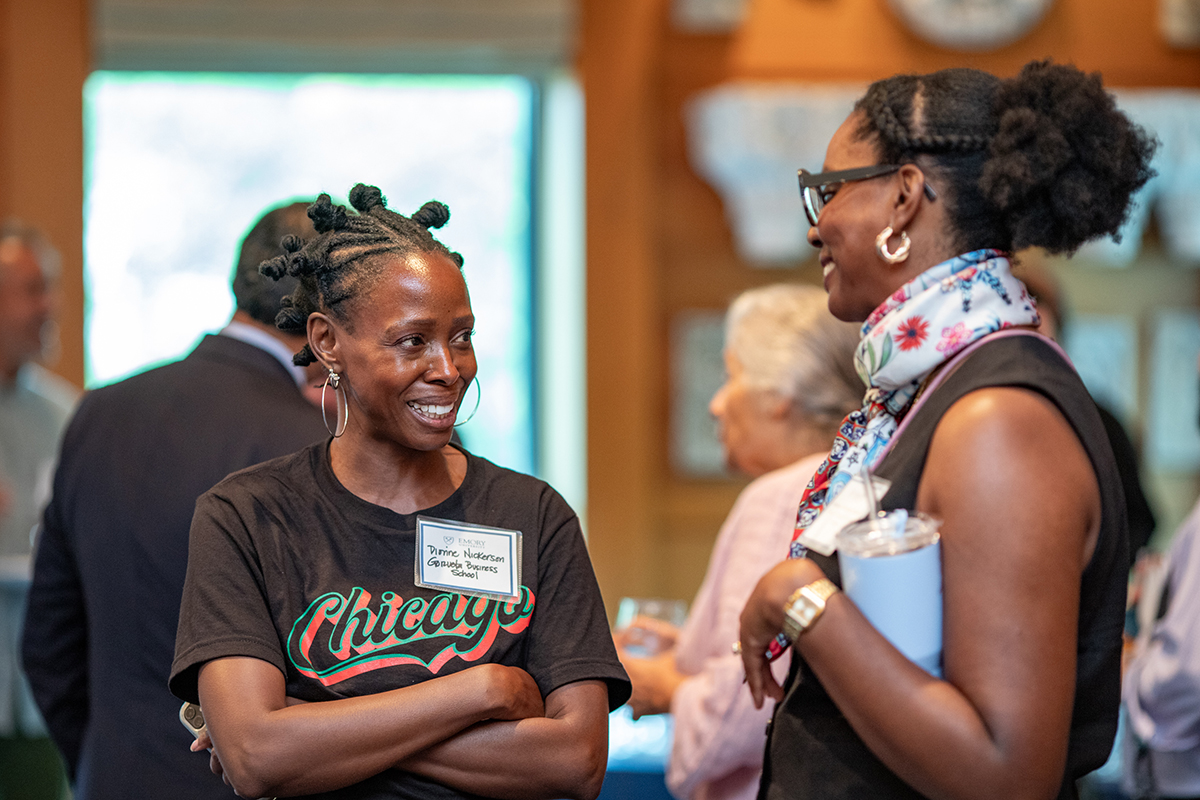 two female faculty members speaking