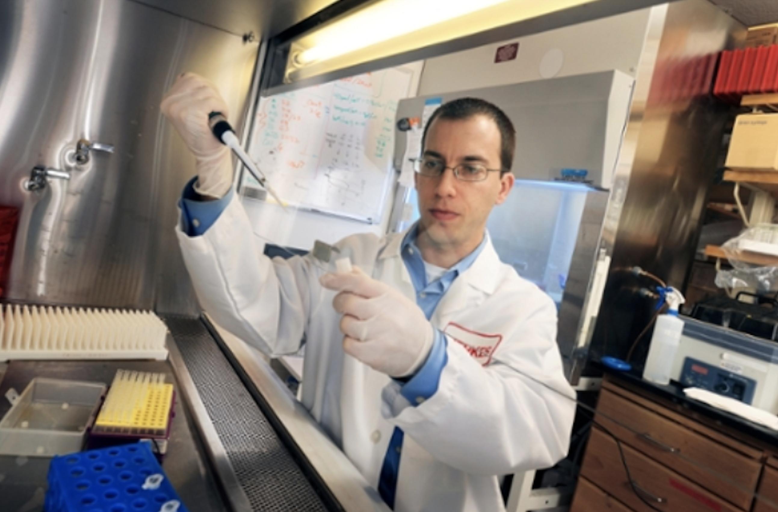 man holding equipment in lab