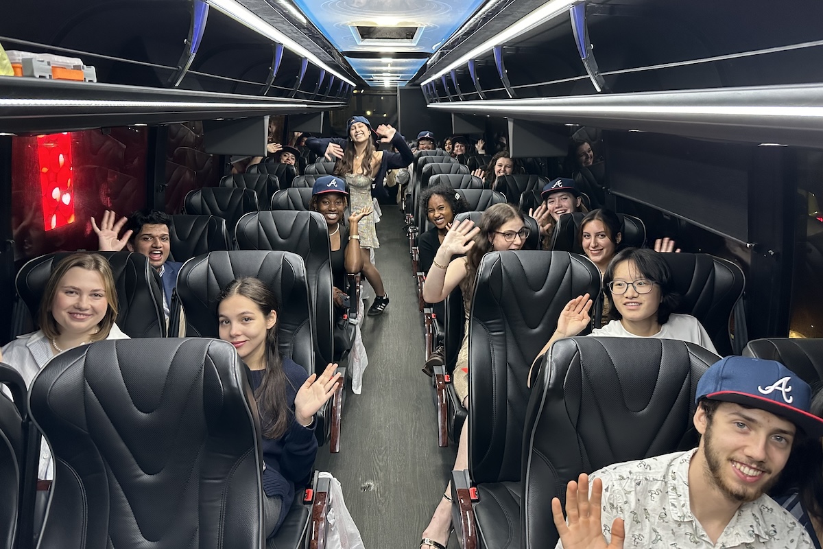 Students posing for photo on bus