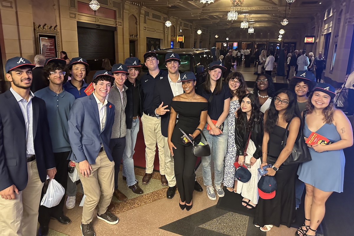 group of students wearing braves hats