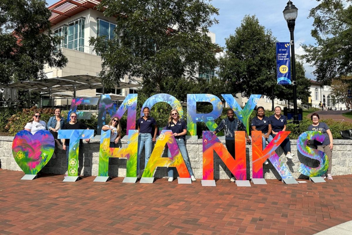 people holding "Emory Thanks" letters