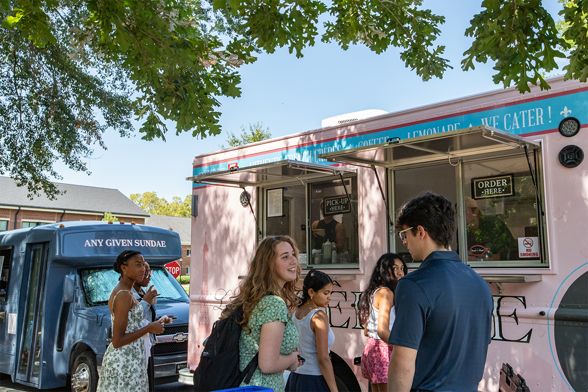 college students buying food at a food truck