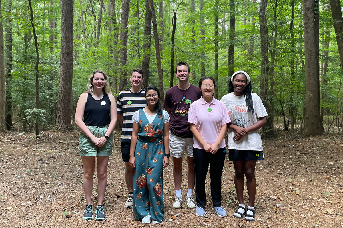 group of graduate students in the woods