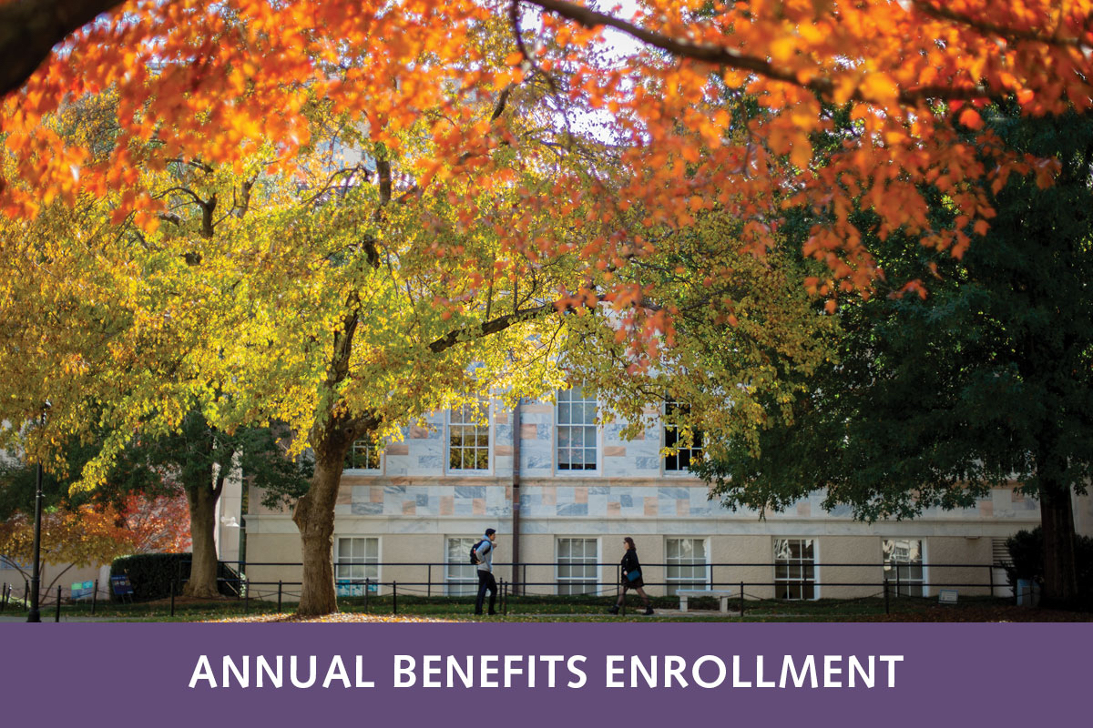 Fall-colored trees on campus with a banner at the bottom that reads Annual Benefits Enrollment